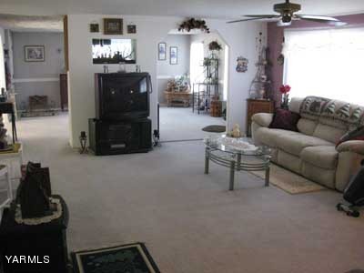 181 Schut Road, Unit 8 Moxee, WA 98936 - Photo 2 of 20 a living room with furniture and a fireplace