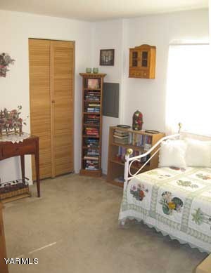 181 Schut Road, Unit 8 Moxee, WA 98936 - Photo 13 of 20 a bedroom with a bed and a cabinets