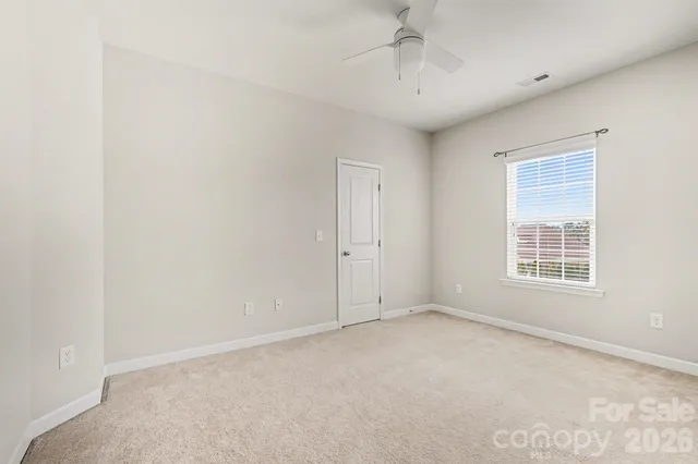 a bathroom with a sink a toilet a mirror and shower