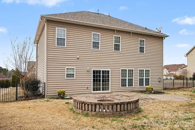 a view of a backyard with plants and trees