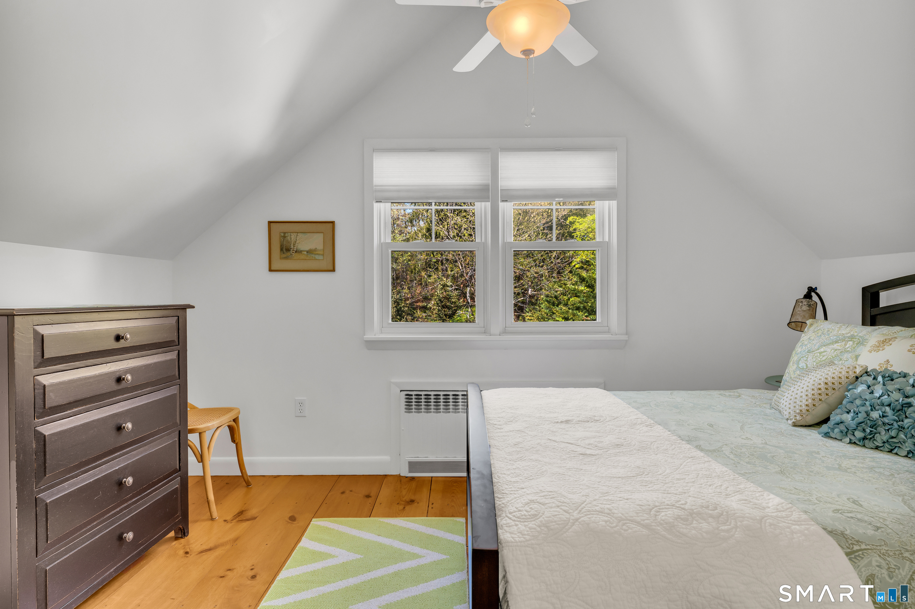 81 Main Street Chester, CT 06412 - Photo 20 of 39 Bedroom or office with vaulted ceiling and a cooling ceiling fan. Central air on the first floor and window units are used on the second floor.