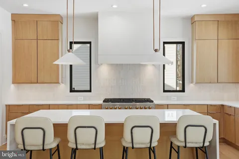 a kitchen with sink cabinets and wooden floor