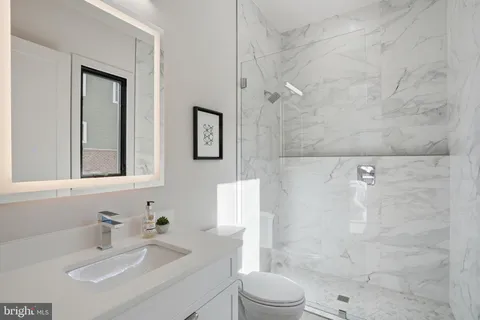 a view of workspace with furniture and wooden floor