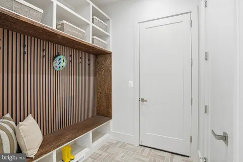 a bedroom with a bed and a desk