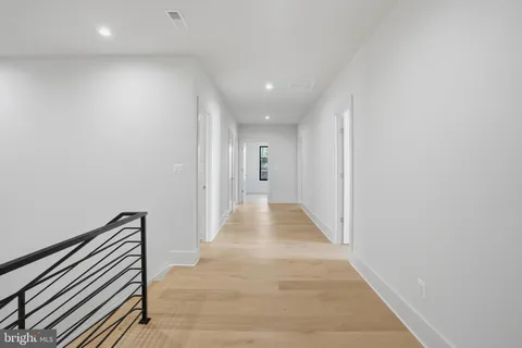 a front view of a house with a garden and yard