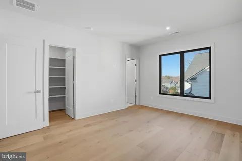 a view of an house with backyard space and garden