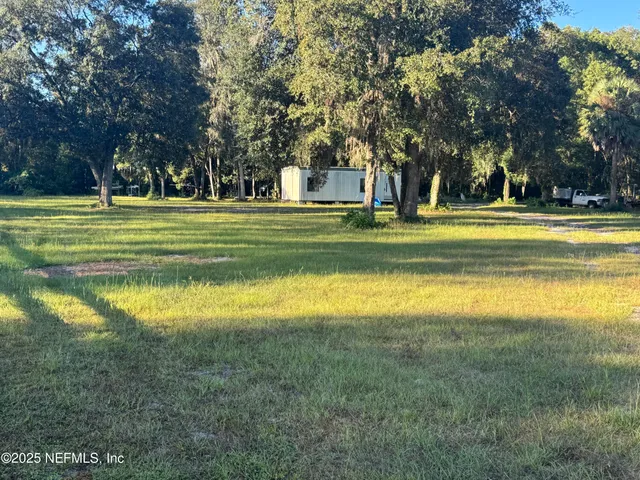 a view of a swimming pool with an outdoor space and seating area