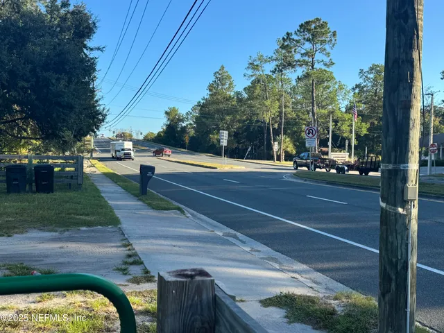 a view of a house with a yard patio and a swimming pool