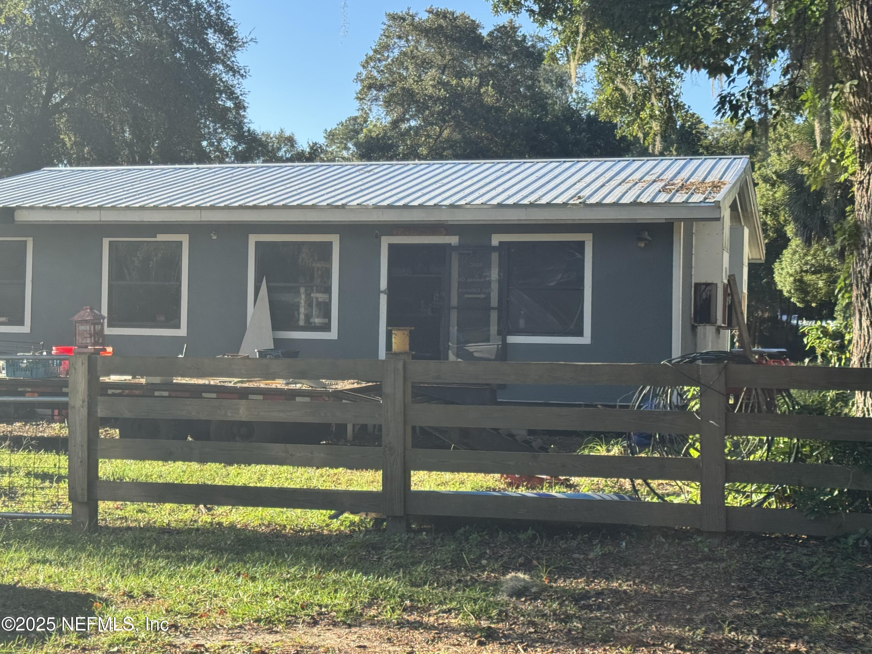 301 Northeast US Highway 301 Waldo, FL 32694 - Photo 46 of 56 a view of a house with a yard patio and a swimming pool