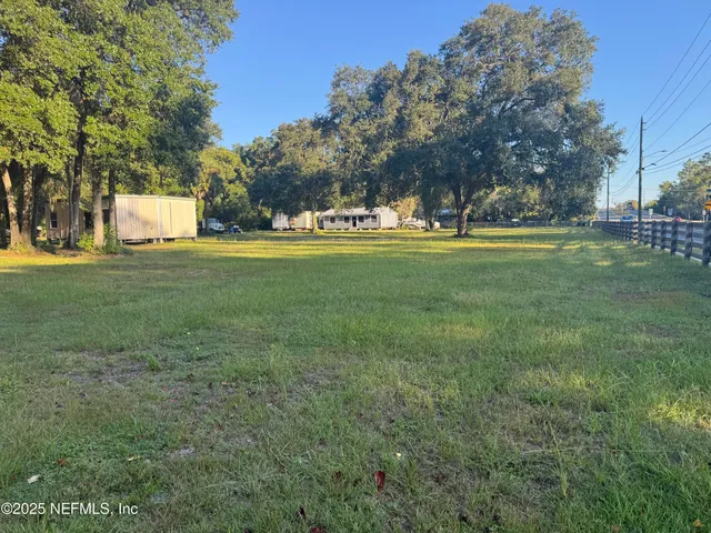 a view of swimming pool with a yard