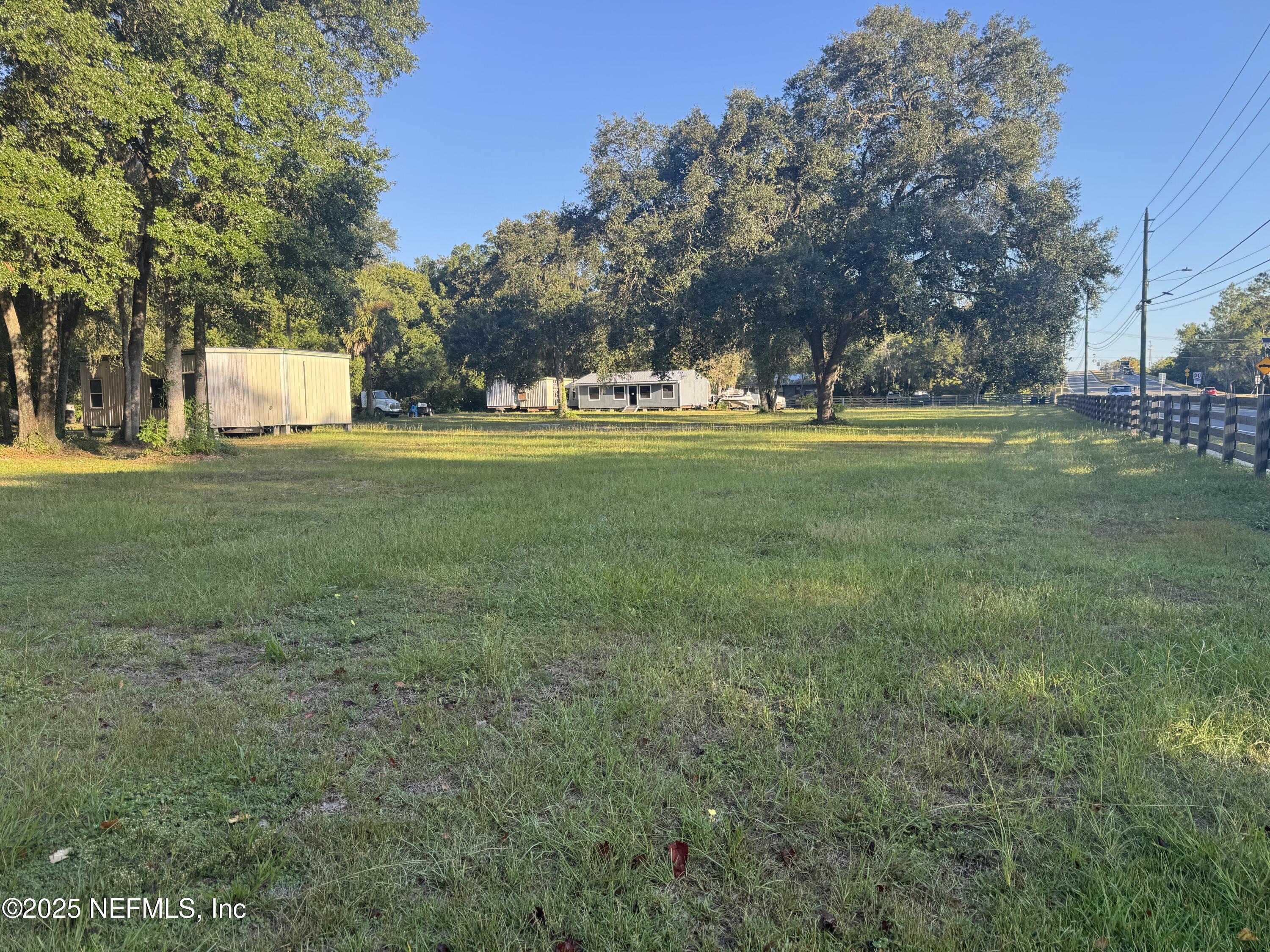 301 Northeast US Highway 301 Waldo, FL 32694 - Photo 5 of 56 a view of outdoor space with green field and trees all around