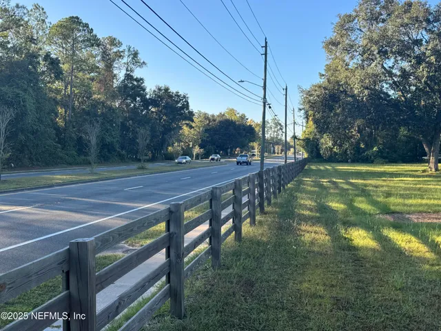 a huge green field with lots of trees