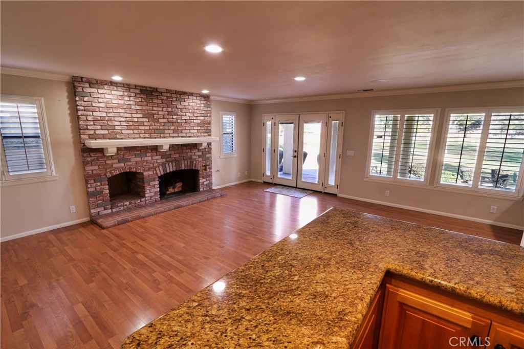 12885 Rain Shadow Road Victorville, CA 92395 - Photo 13 of 26 an empty room with windows and fireplace