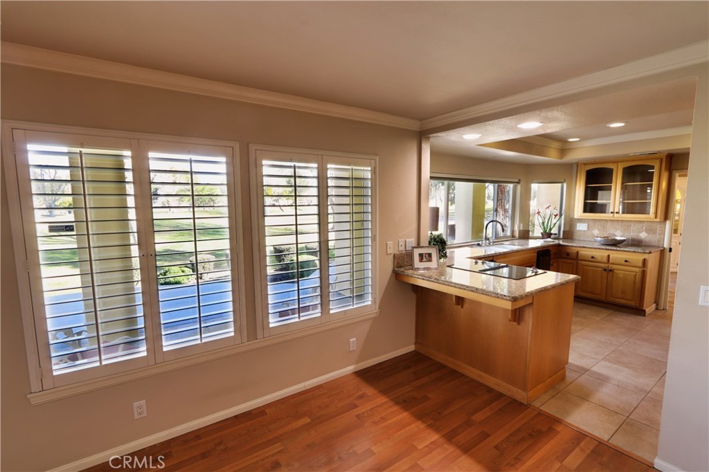 12885 Rain Shadow Road Victorville, CA 92395 - Photo 15 of 26 a view of kitchen with granite countertop a sink and a stove top oven