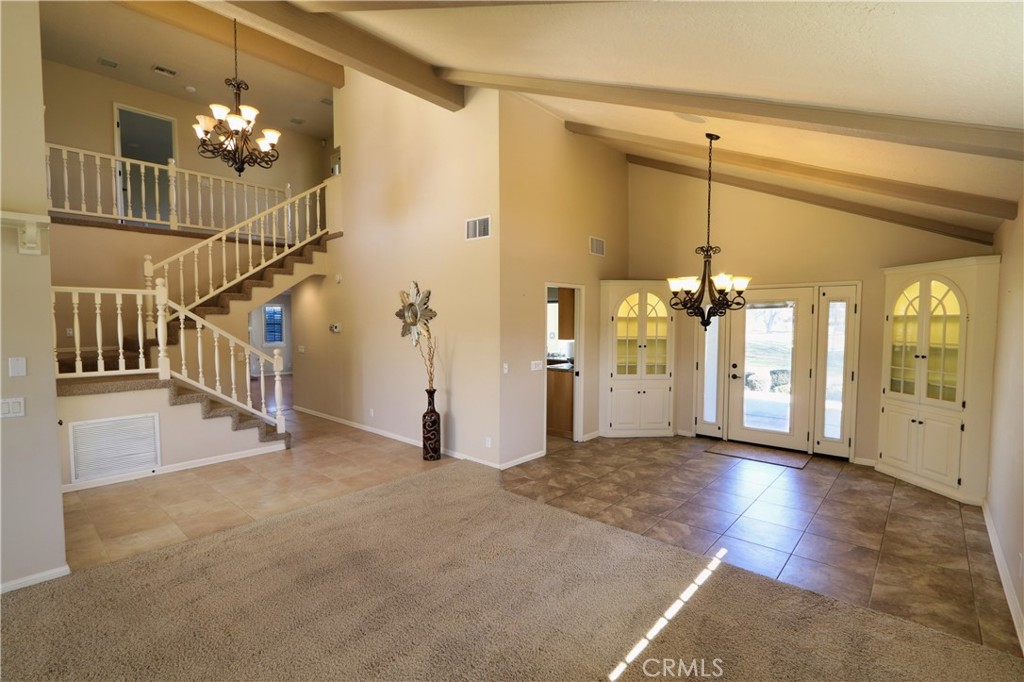 12885 Rain Shadow Road Victorville, CA 92395 - Photo 20 of 26 a view of a livingroom with a staircase