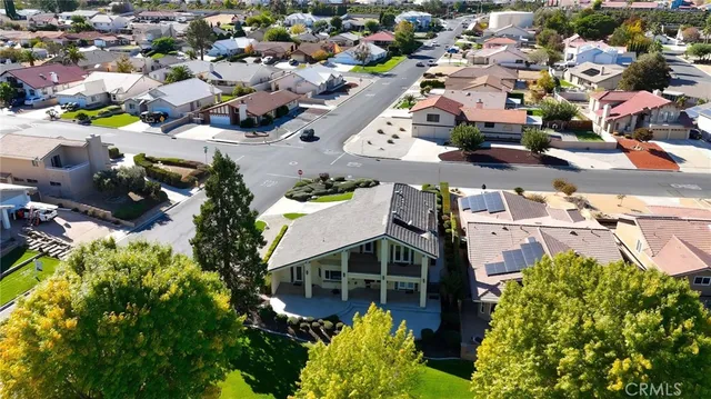 an aerial view of a houses with yard