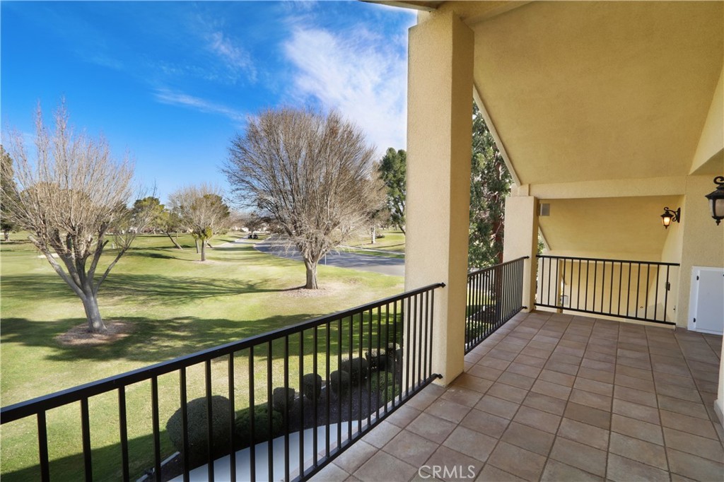12885 Rain Shadow Road Victorville, CA 92395 - Photo 7 of 26 a view of a balcony with wooden floor