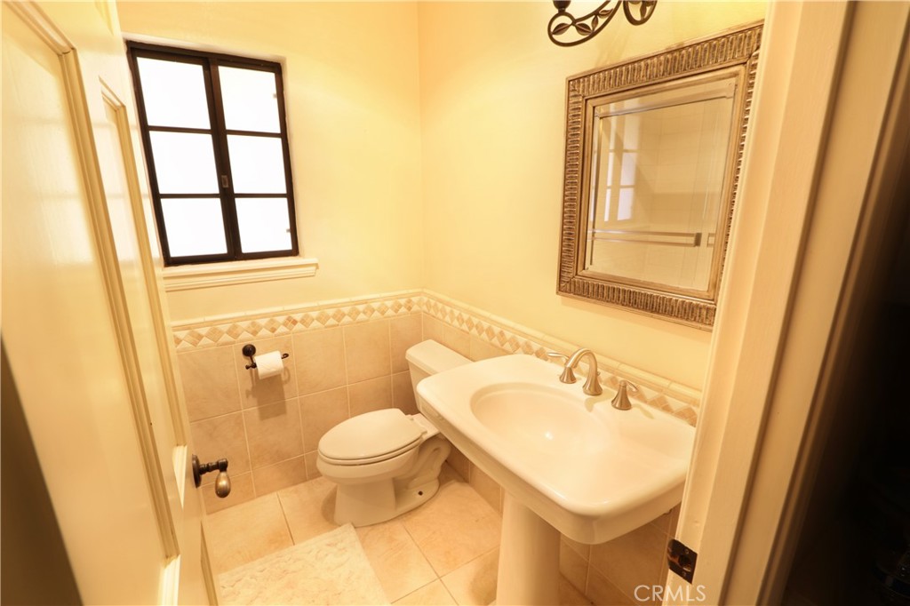 12885 Rain Shadow Road Victorville, CA 92395 - Photo 9 of 26 a bathroom with a sink and a mirror
