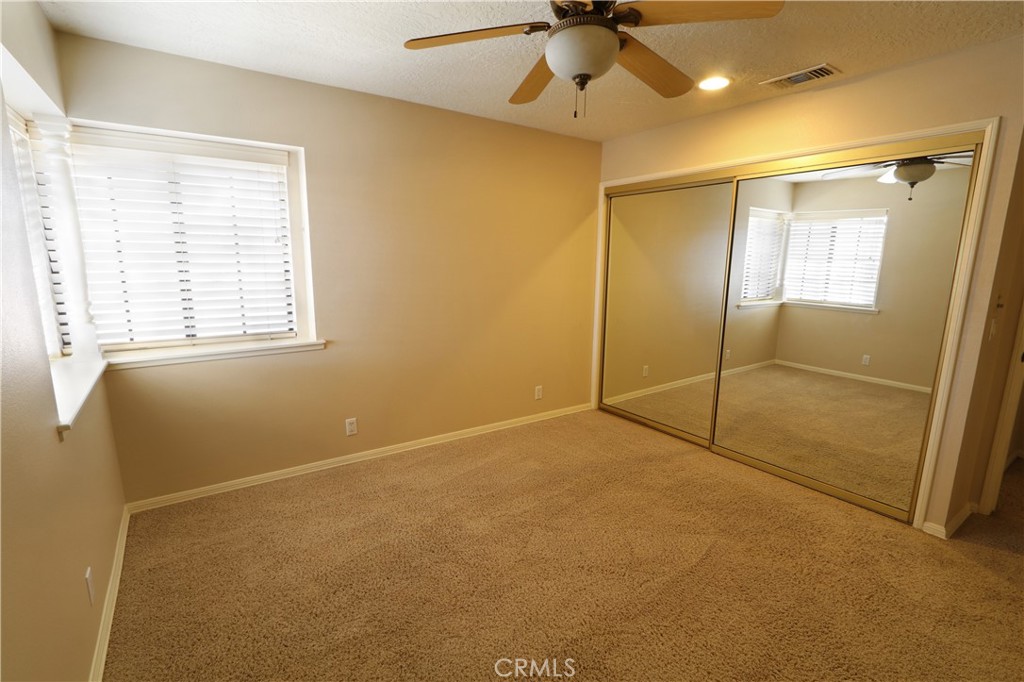 12885 Rain Shadow Road Victorville, CA 92395 - Photo 10 of 26 a view of an empty room with a window