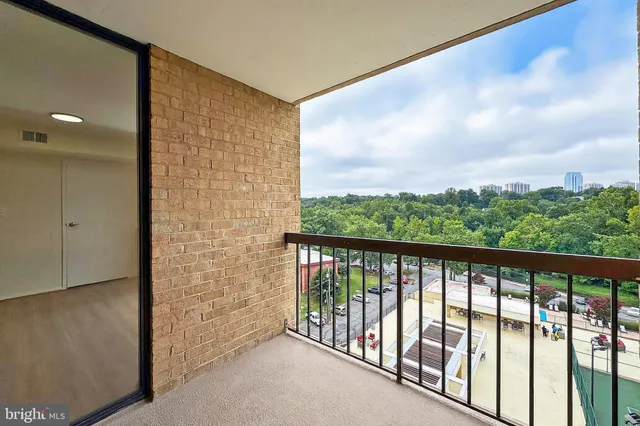 a view of balcony with furniture