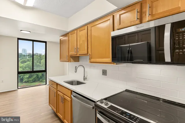 a kitchen with a sink and a microwave