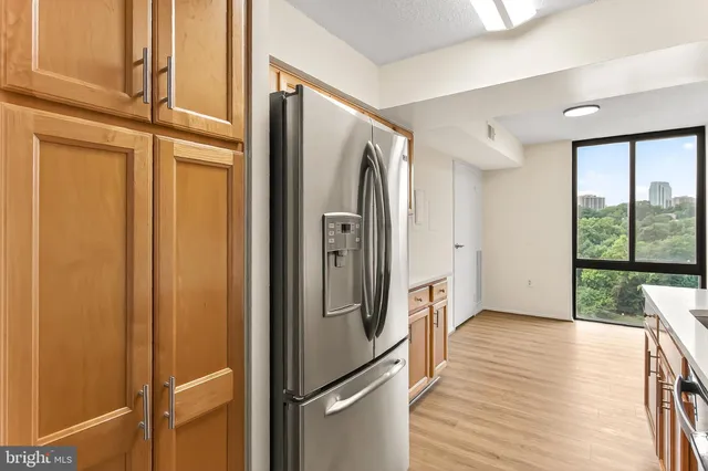 a view of hallway with wooden floor and stairs
