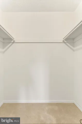 a view of a hallway with washer and dryer