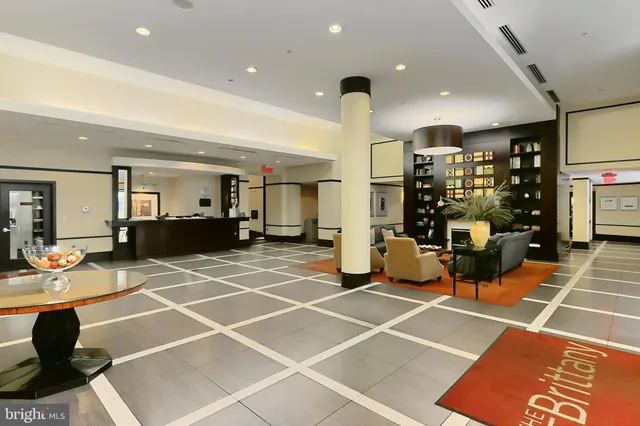 a gym with lots of tables and chairs