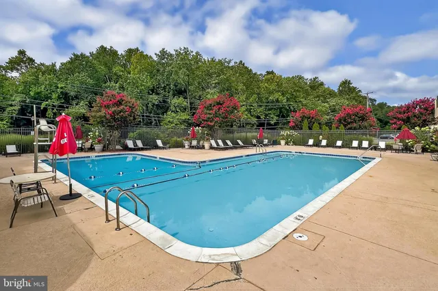 a view of swimming pool with outdoor seating
