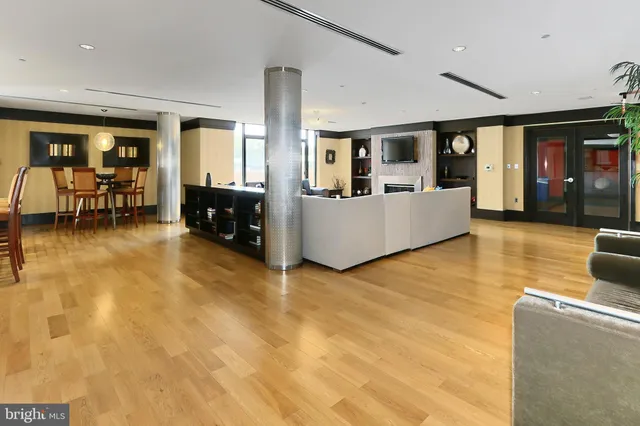 a large white kitchen with a large window