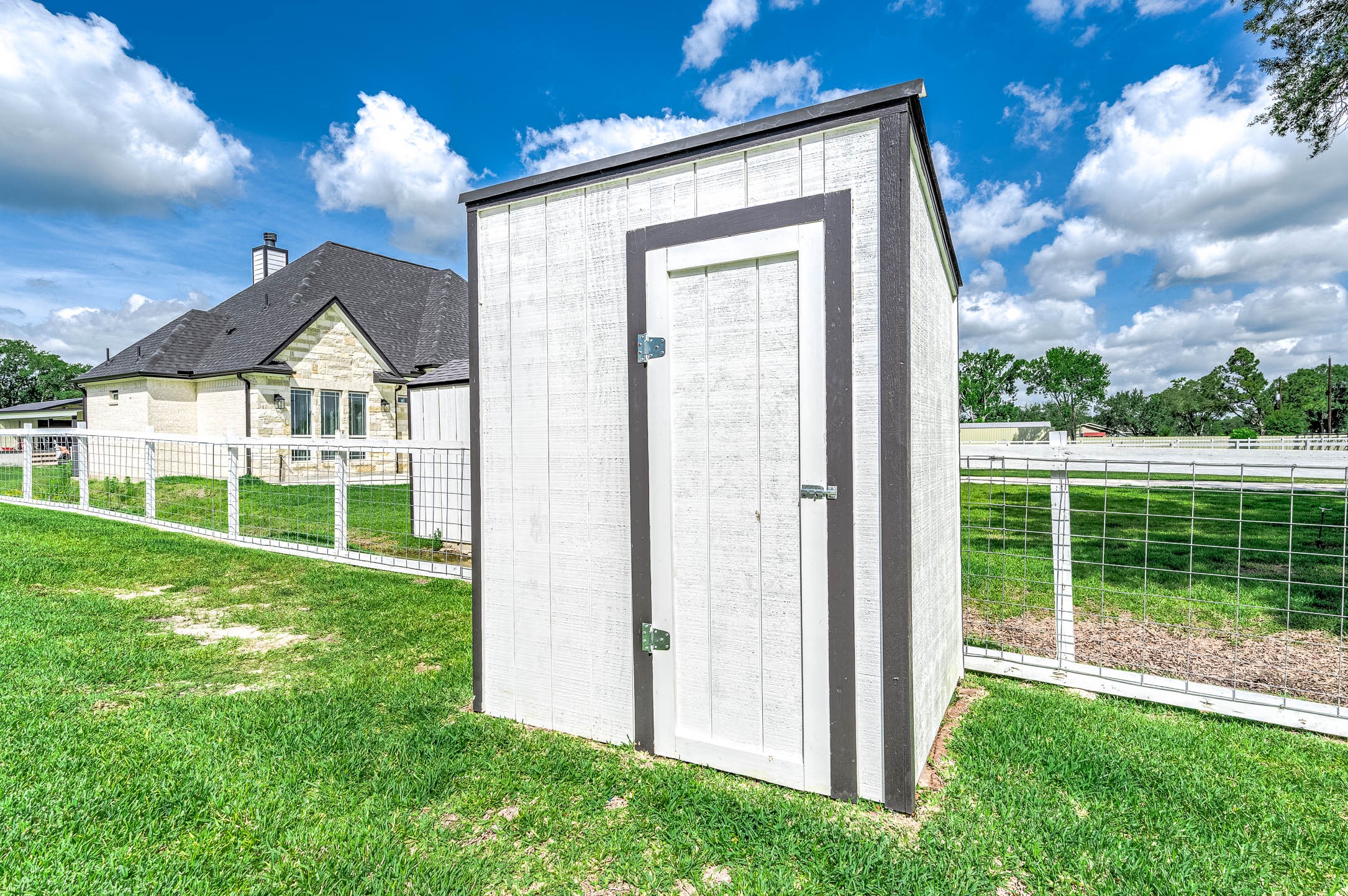 8032 Short Road Needville, TX 77461 - Photo 26 of 50 This structure houses the property’s water well and is conveniently positioned within the backyard.