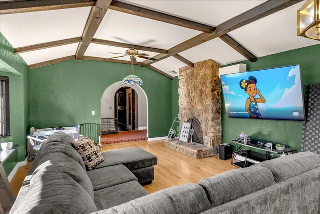 a living room with furniture and a fireplace