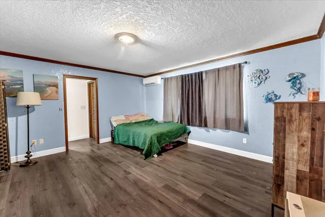a view of a room with wooden floor and window