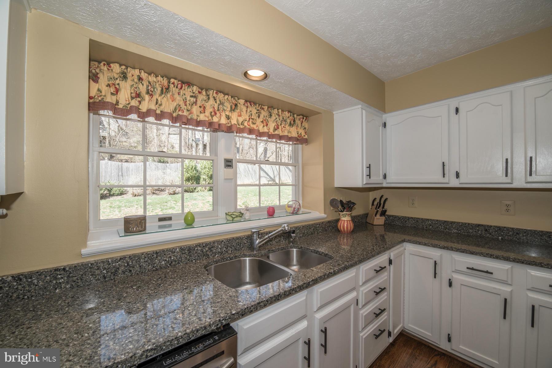 1206 Brookview Road Towson, MD 21286 - Photo 19 of 29 a kitchen with granite countertop a sink and a window