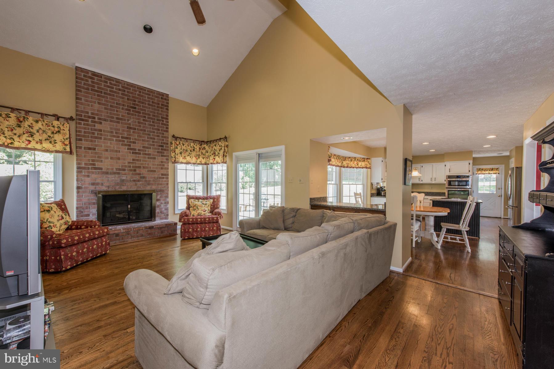 1206 Brookview Road Towson, MD 21286 - Photo 3 of 29 a living room with furniture and a fireplace