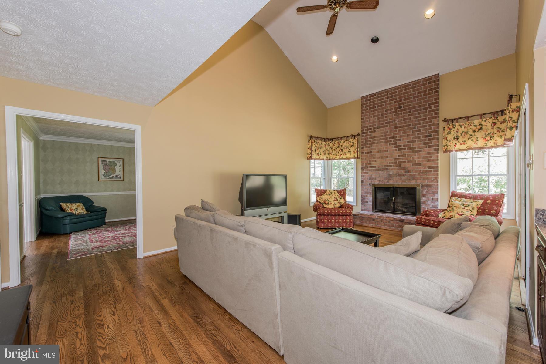 1206 Brookview Road Towson, MD 21286 - Photo 5 of 29 a living room with furniture and a fireplace