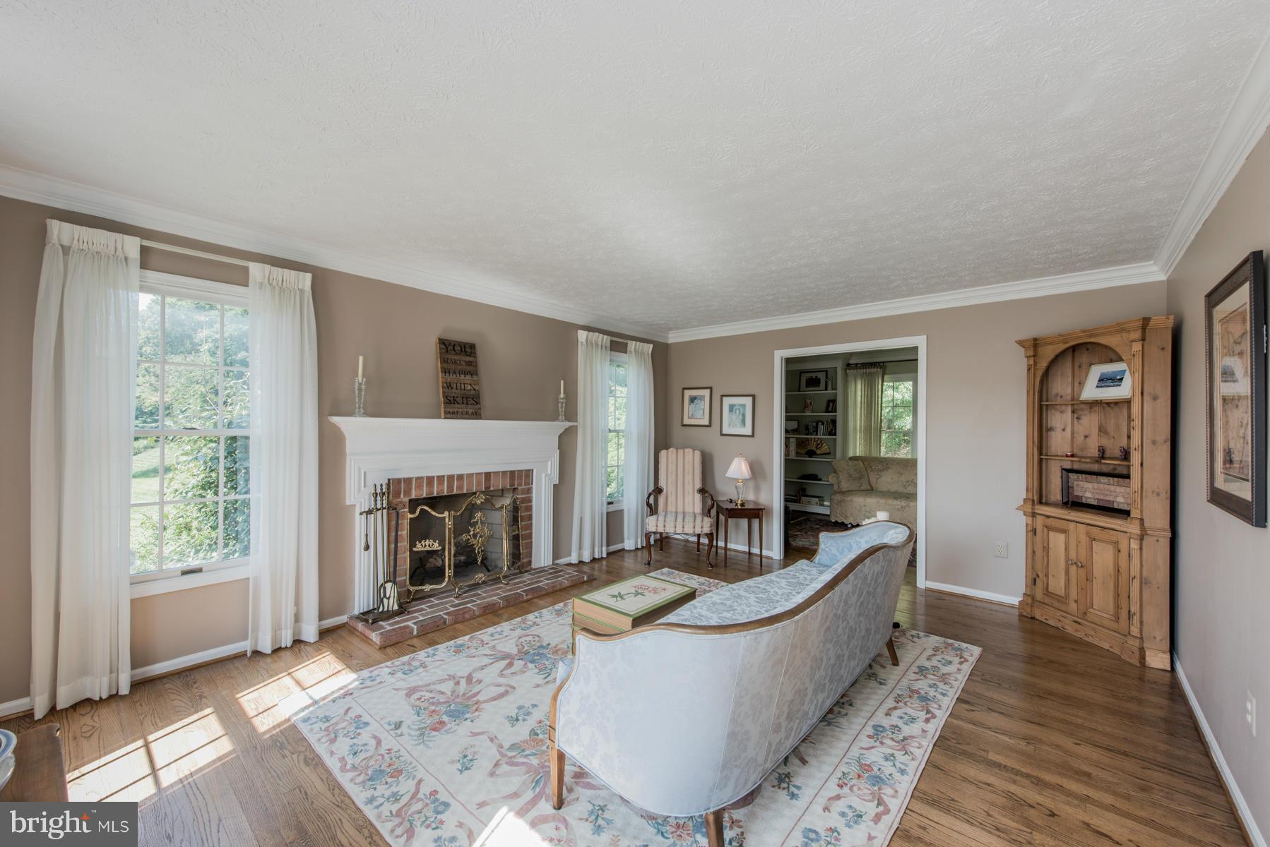 1206 Brookview Road Towson, MD 21286 - Photo 9 of 29 a living room with furniture and a fireplace