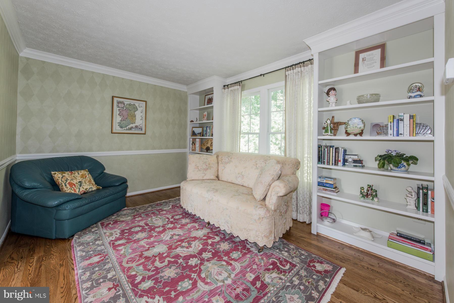 1206 Brookview Road Towson, MD 21286 - Photo 10 of 29 a living room with furniture and a book shelf