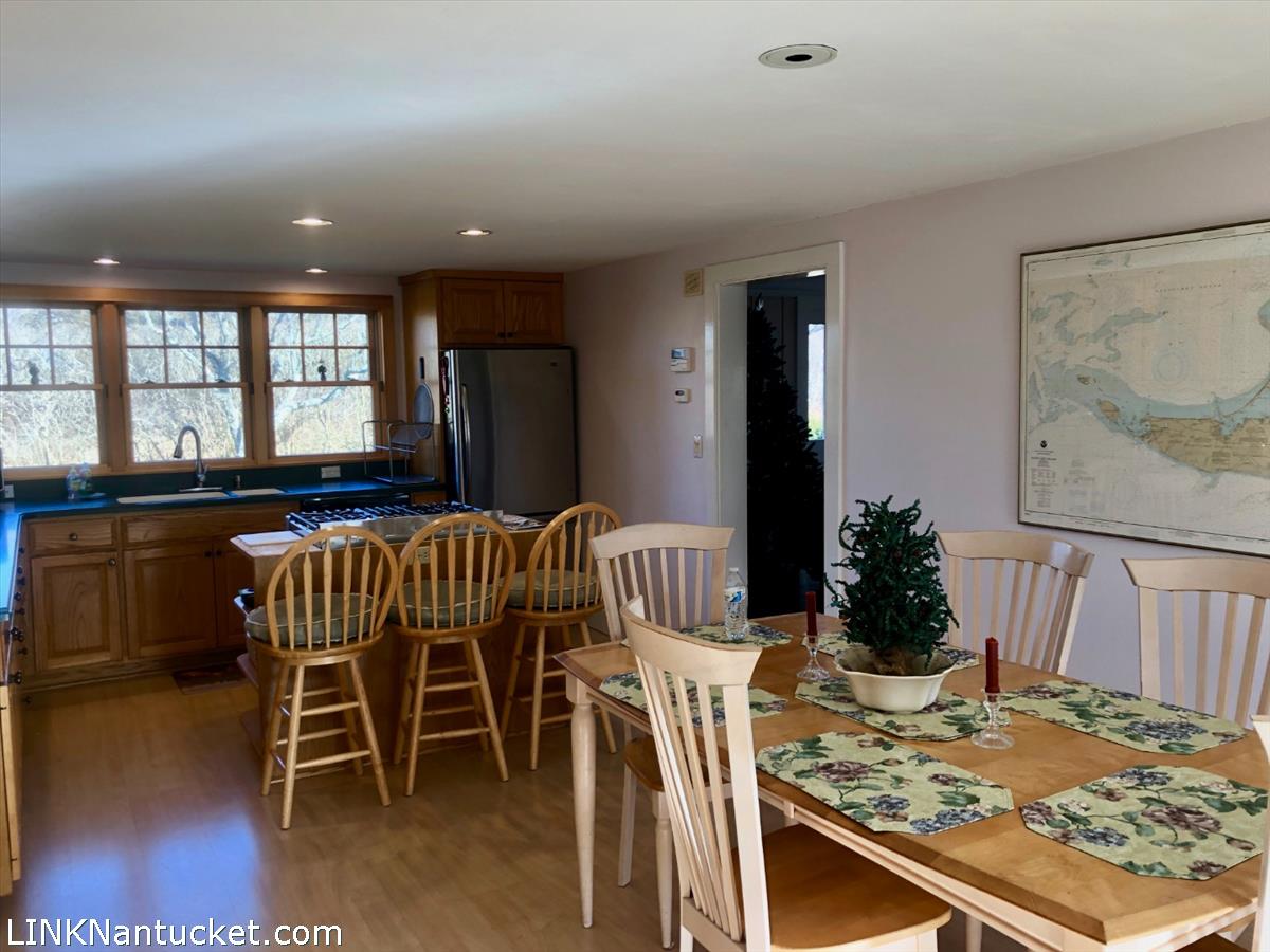 8 M Street Nantucket, MA 02554 - Photo 9 of 20 a view of a dining room with furniture window and wooden floor
