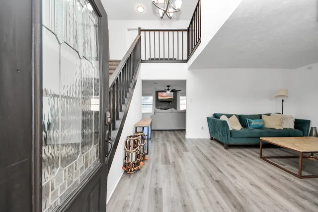 a bedroom with a bed and a large mirror