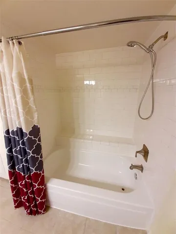 a bathroom with a shower and a shower