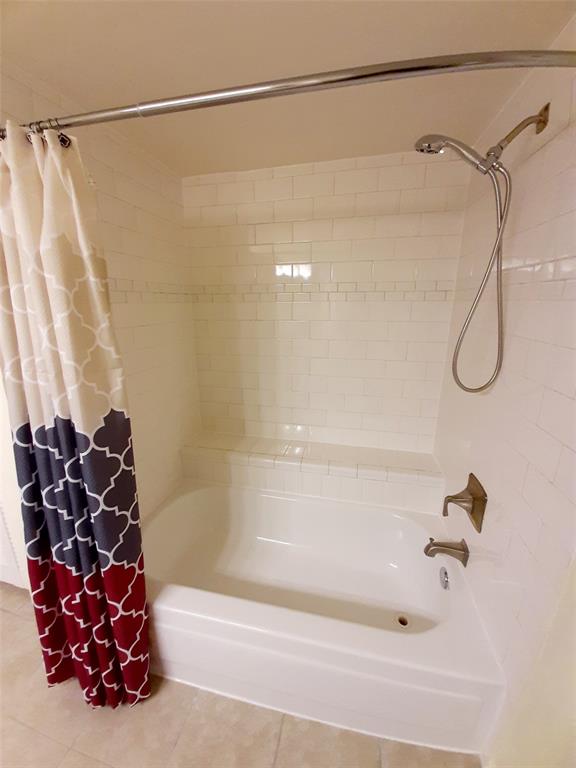16301 Ledgemont Lane, Unit 207 Addison, TX 75001 - Photo 14 of 14 a bathroom with a shower and a shower
