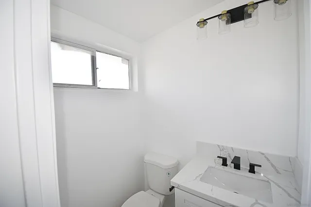 a bathroom with a sink and a toilet