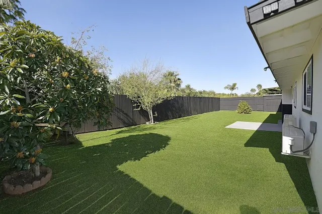 a view of yard with swimming pool