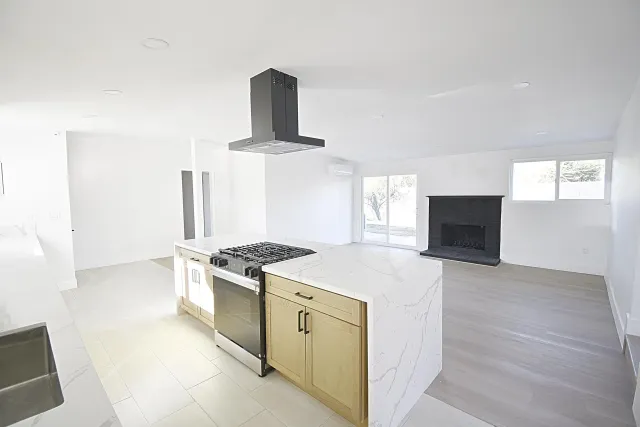 a kitchen with a stove and a sink