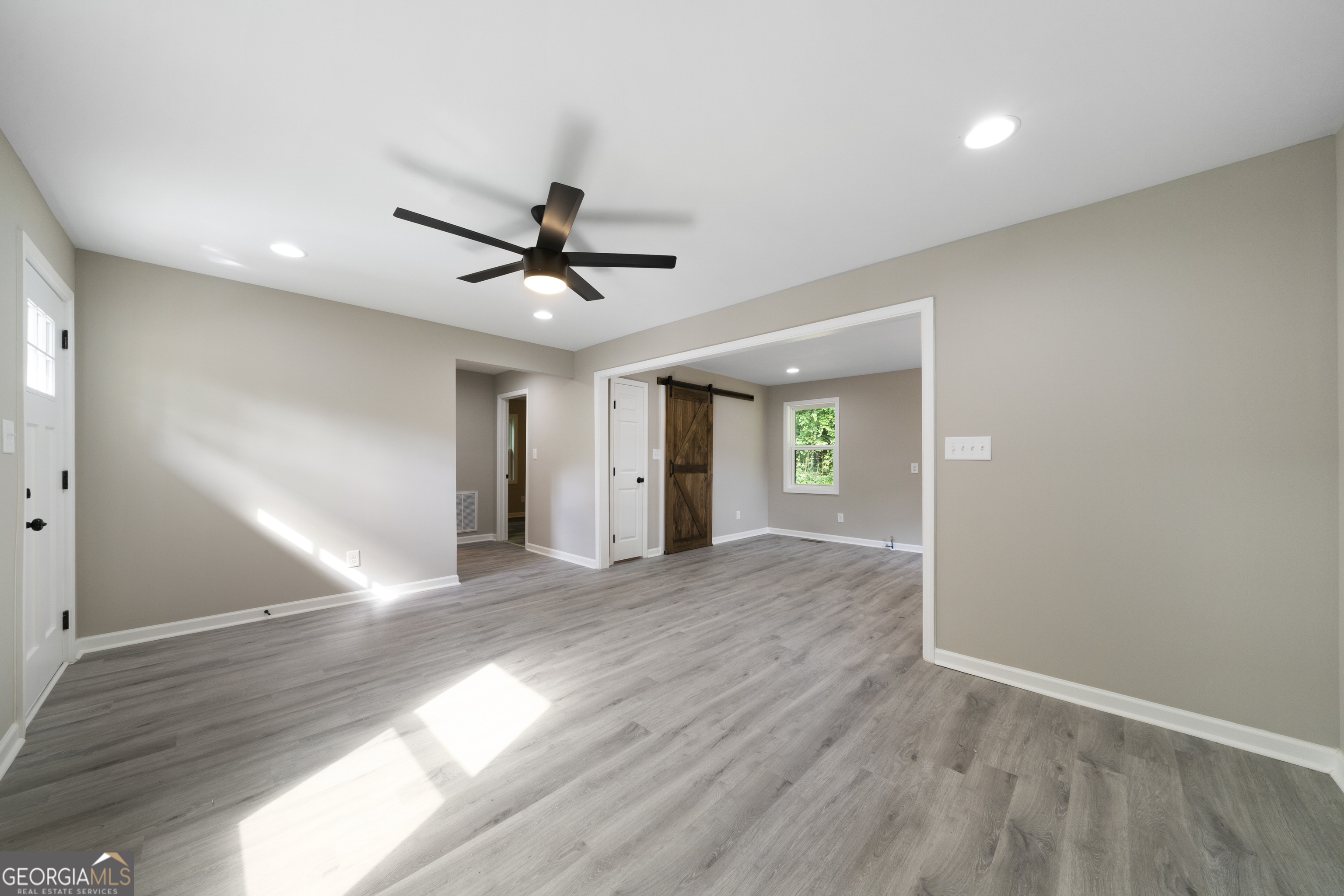 515 Harper Avenue Southwest Rome, GA 30161 - Photo 7 of 17 a view of an empty room with window and wooden floor