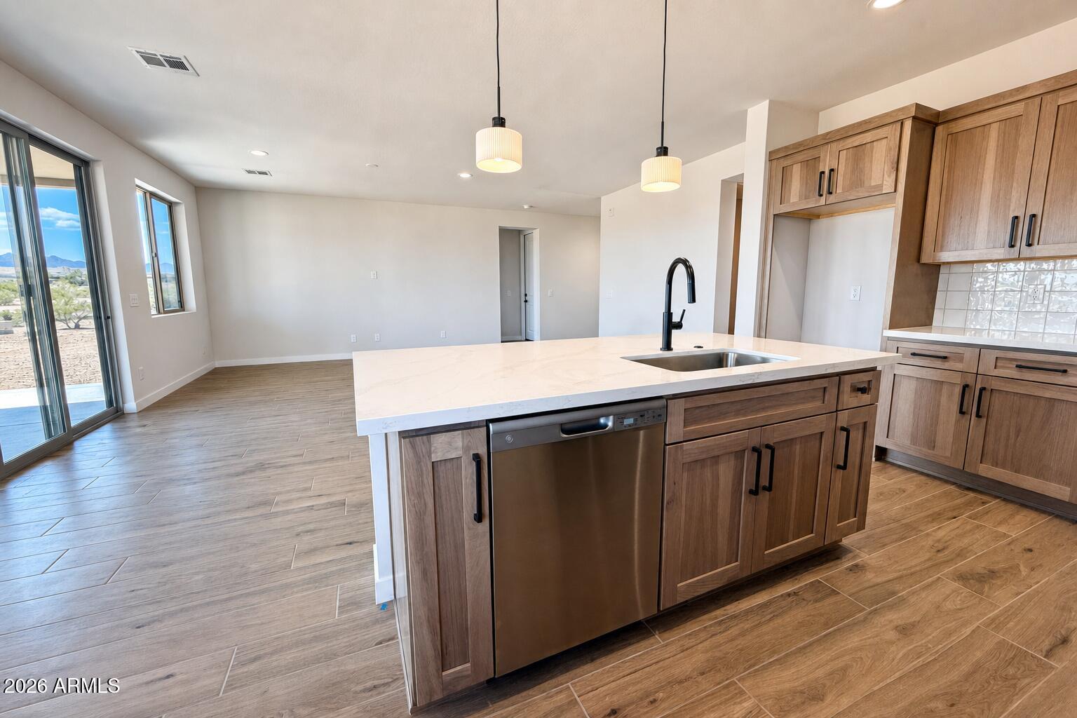 16957 East Bobwhite Way Rio Verde, AZ 85263 - Photo 11 of 25 a kitchen with a sink and wooden floor