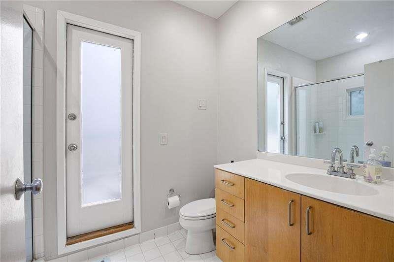 2176 Millennium Way Atlanta, GA 30319 - Photo 11 of 16 a bathroom with a sink a toilet and shower