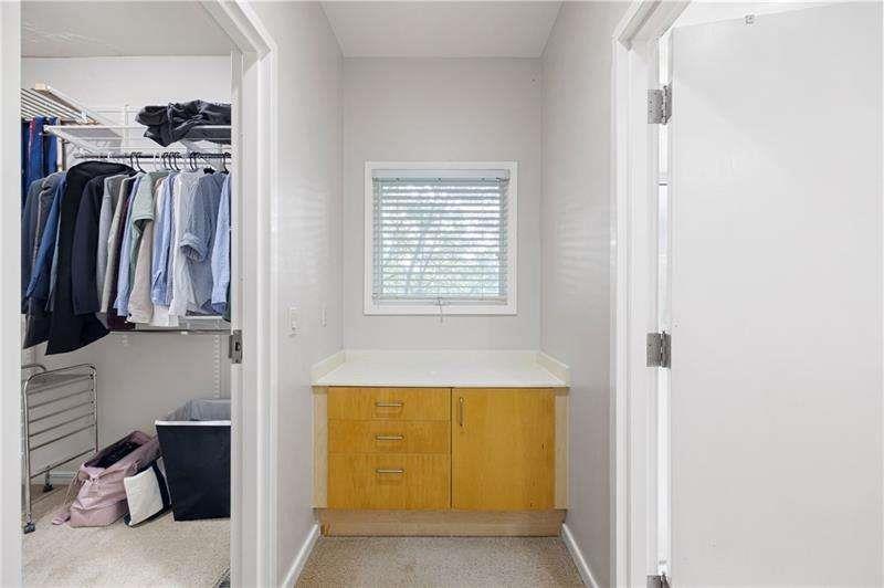 2176 Millennium Way Atlanta, GA 30319 - Photo 12 of 16 a view of walk in closet with clothes and shoes