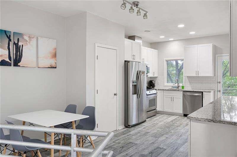 2176 Millennium Way Atlanta, GA 30319 - Photo 8 of 16 a kitchen with a refrigerator and a sink